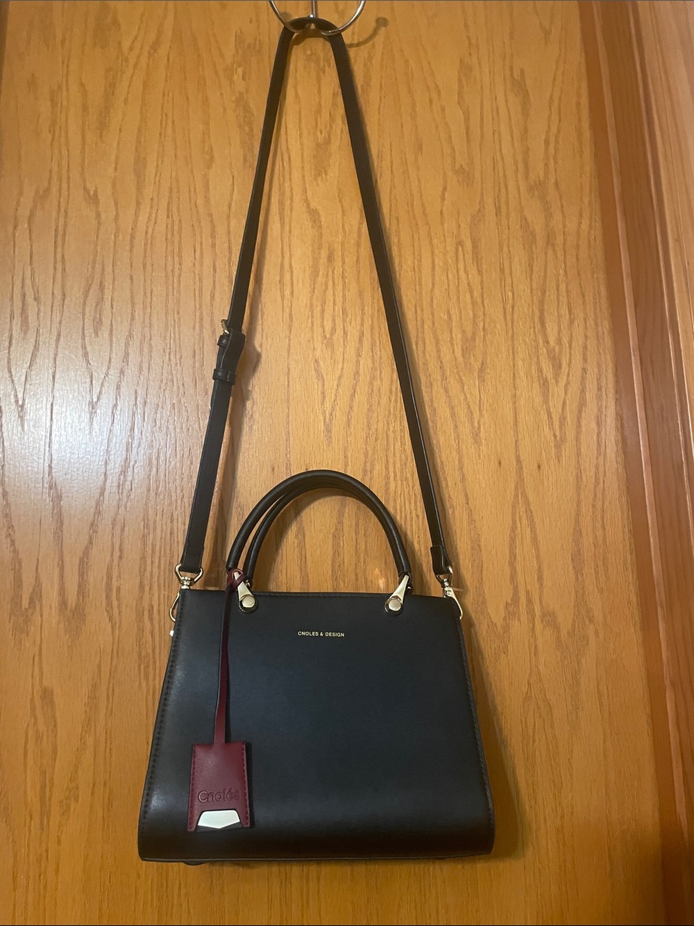 Cnole’s & Design Black Leather Satchel with Burgundy Tag and burgundy ends